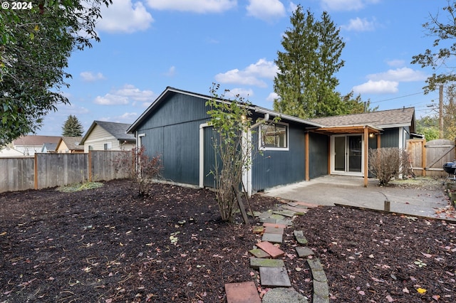 rear view of property featuring a patio area