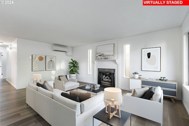 living room with an AC wall unit and dark wood-type flooring