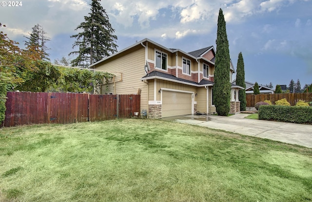 view of front of house featuring a garage and a front yard