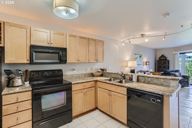 kitchen with light brown cabinetry, sink, kitchen peninsula, and black appliances