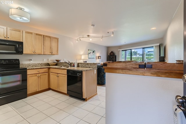 kitchen with kitchen peninsula, light brown cabinets, light tile patterned floors, black appliances, and sink