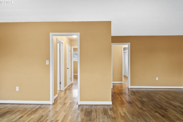 spare room with wood-type flooring