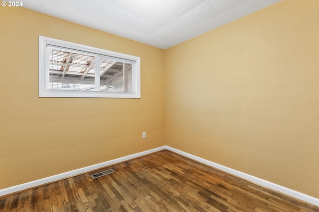 unfurnished room featuring hardwood / wood-style floors