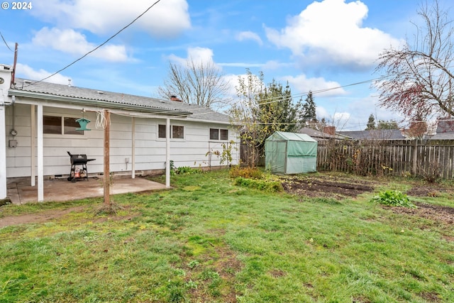 view of yard with a patio area and an outdoor structure