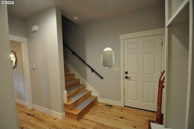 foyer with light hardwood / wood-style floors