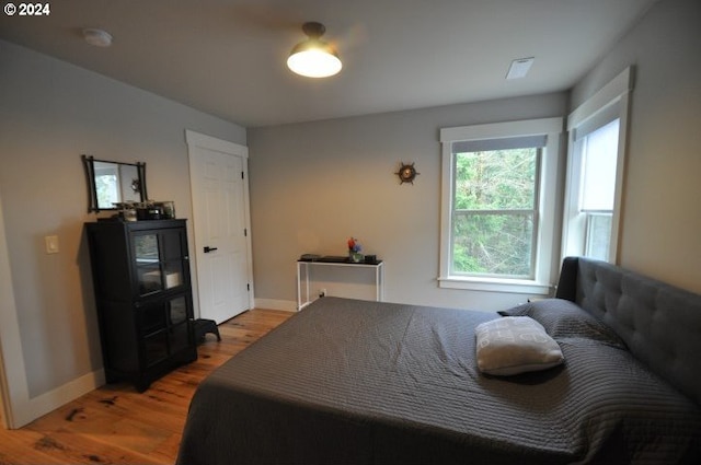 bedroom featuring wood-type flooring