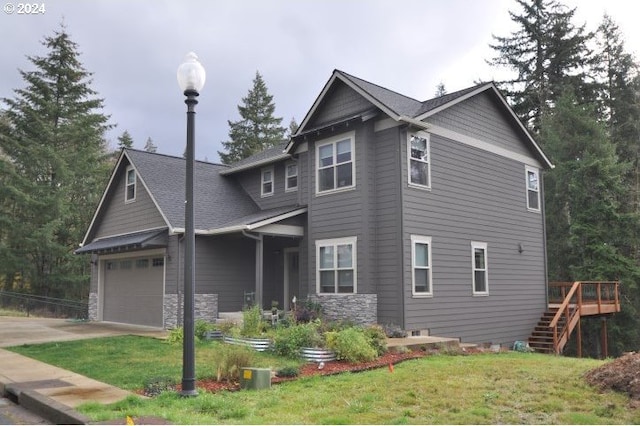 view of front of property featuring a garage and a front yard