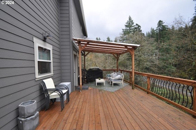 deck featuring an outdoor hangout area, a pergola, and grilling area