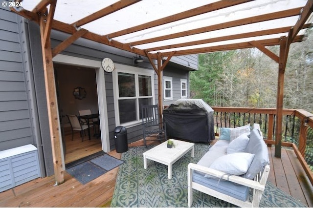 deck featuring outdoor lounge area, a grill, and a pergola