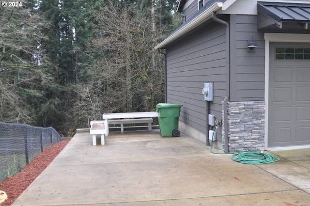 view of patio with a garage