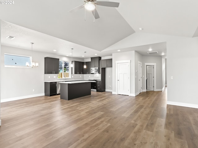 kitchen with wood-type flooring, a healthy amount of sunlight, and a center island