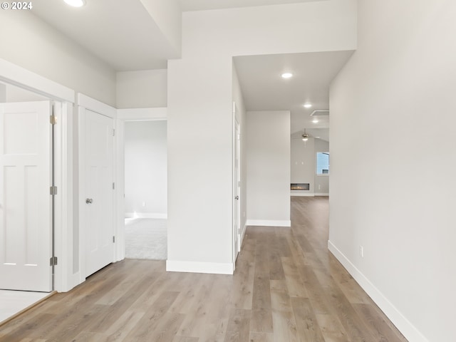 hall with light wood-type flooring