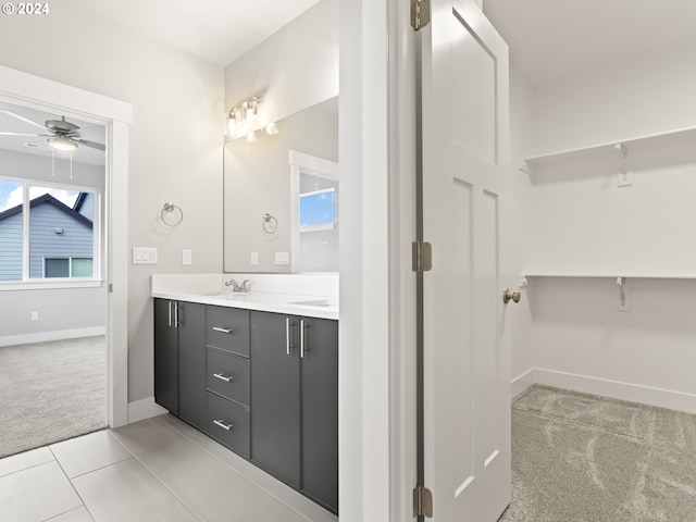 bathroom featuring tile patterned floors, vanity, and ceiling fan