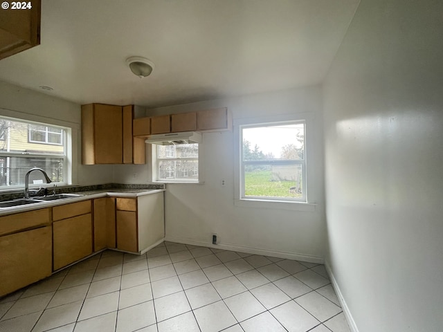 kitchen with sink and light tile patterned floors