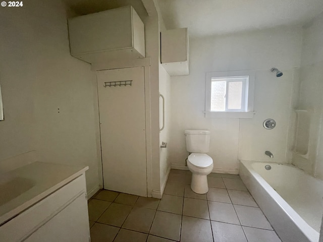 full bathroom featuring tile patterned floors, vanity, bathtub / shower combination, and toilet