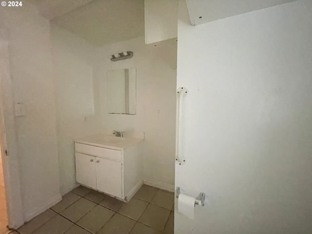 bathroom featuring tile patterned flooring and vanity