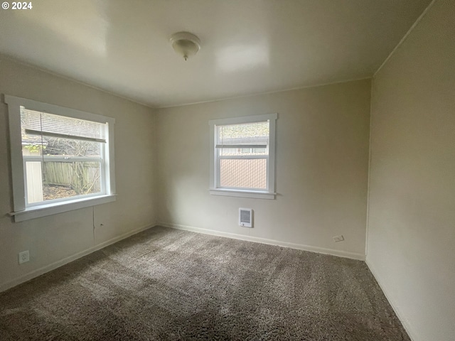 empty room featuring carpet flooring