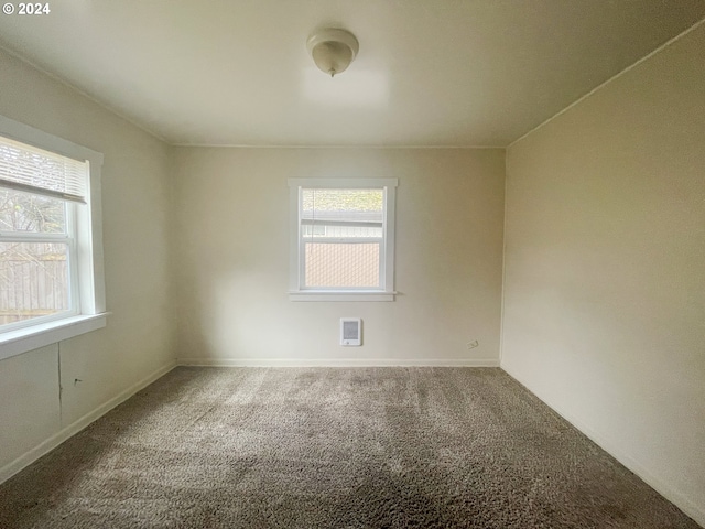 empty room with carpet flooring