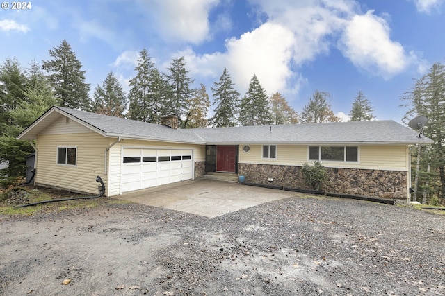 single story home featuring a garage