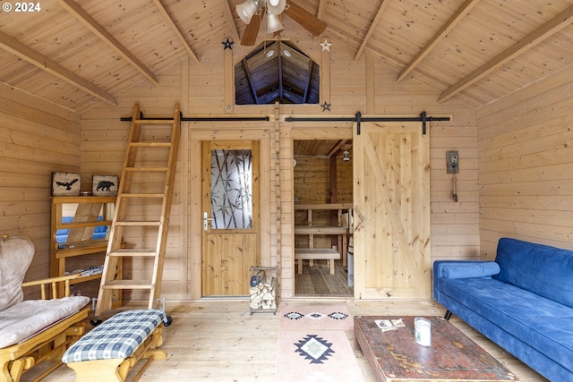 unfurnished living room with wooden walls, hardwood / wood-style floors, beamed ceiling, and wooden ceiling