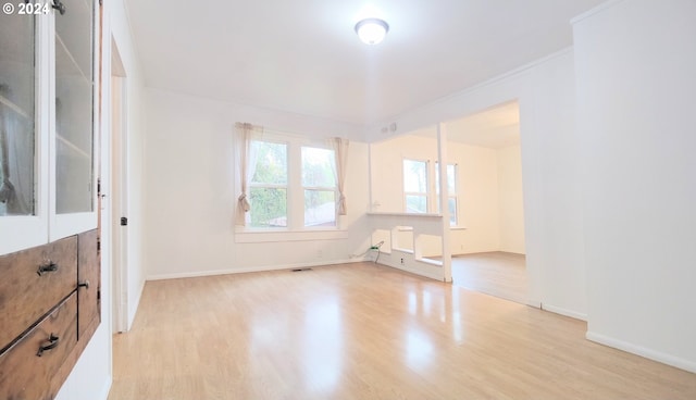 unfurnished room with light hardwood / wood-style flooring