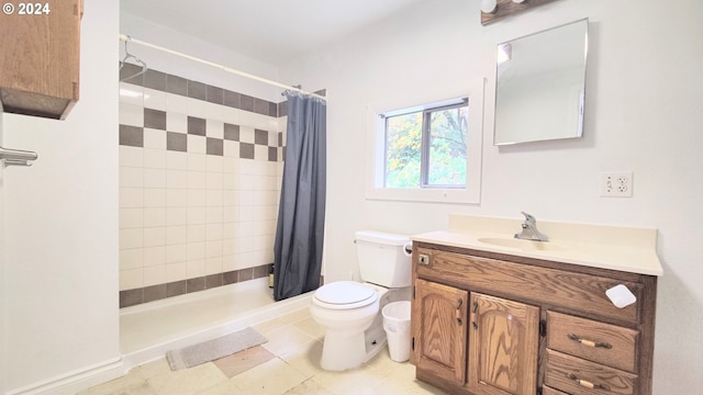 bathroom with vanity, tile patterned floors, toilet, and walk in shower