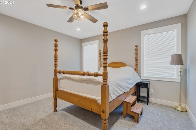 bedroom with light colored carpet and ceiling fan