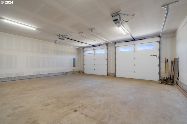 garage featuring a garage door opener and electric panel