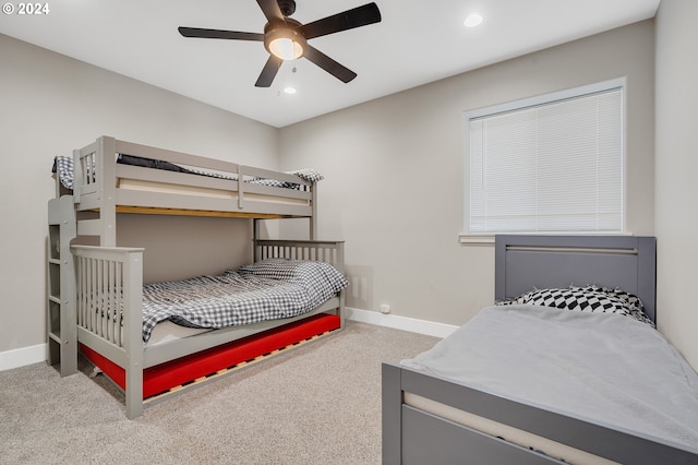 bedroom featuring ceiling fan and carpet