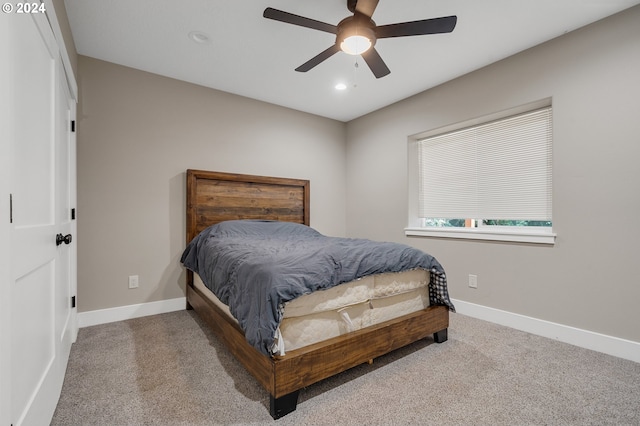 carpeted bedroom featuring ceiling fan