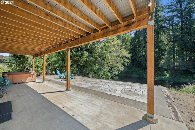 view of patio / terrace with a hot tub