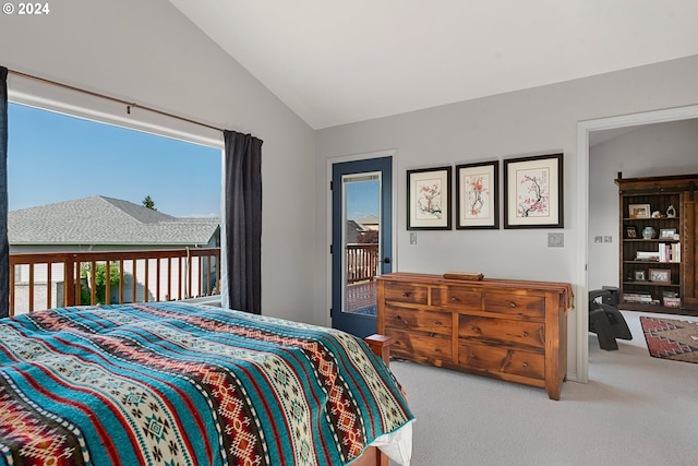 carpeted bedroom with lofted ceiling and access to outside