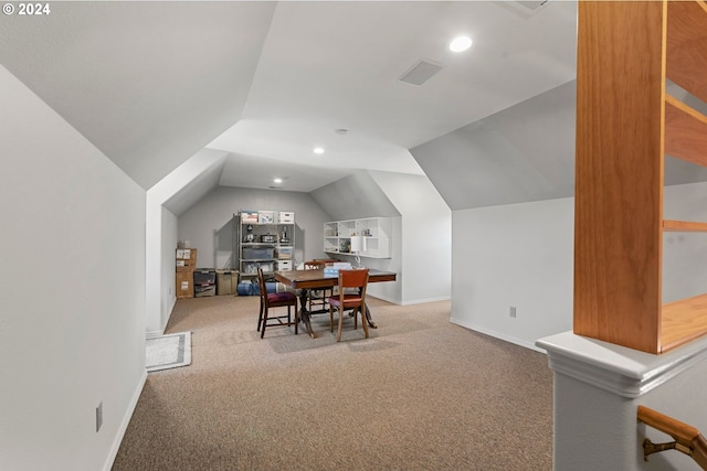 carpeted dining area with recessed lighting, vaulted ceiling, and baseboards