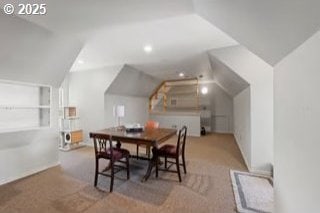 dining space with lofted ceiling, carpet, and recessed lighting