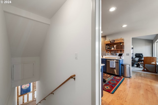 stairs featuring recessed lighting, washer / clothes dryer, and wood finished floors