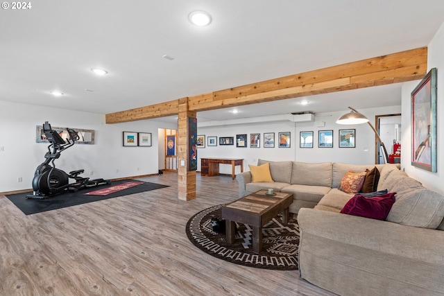 living area with baseboards, beamed ceiling, wood finished floors, and recessed lighting