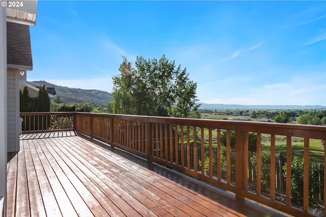 wooden deck with a mountain view