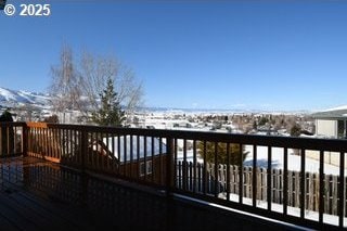 view of snow covered deck