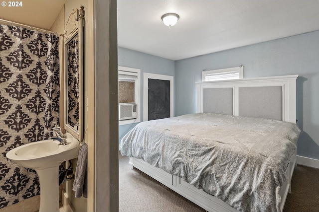 bedroom with cooling unit and carpet floors