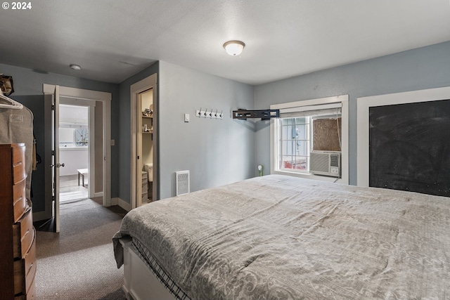 carpeted bedroom with a textured ceiling