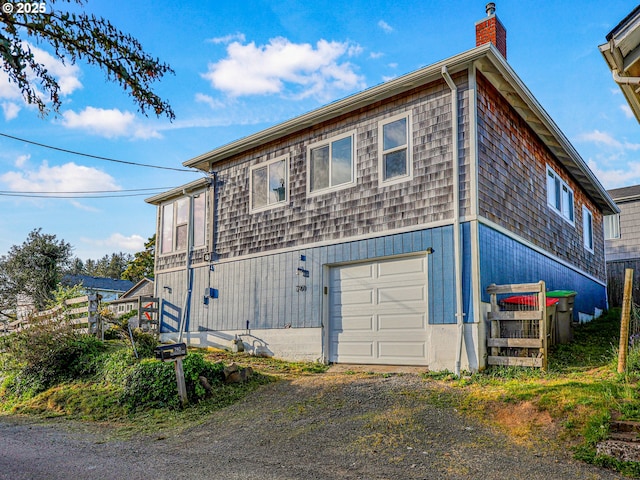 740 Florence Ave, Astoria, OR 97103 - view of side of home featuring a chimney and dirt driveway