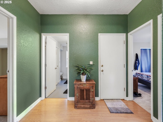740 Florence Ave, Astoria, OR 97103 - hall featuring a textured wall and wood finished floors