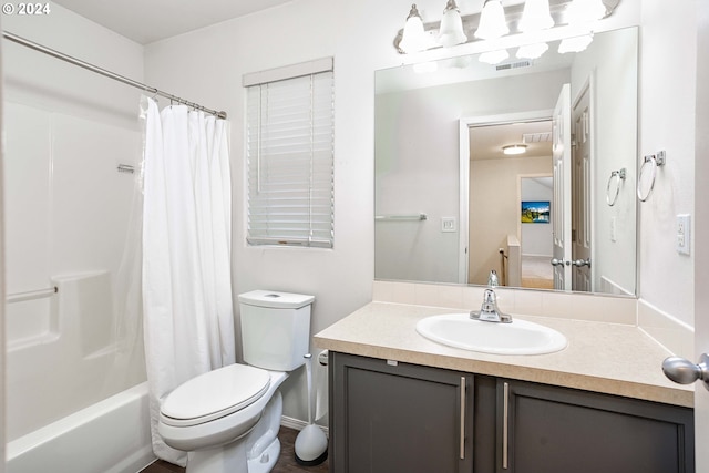 full bathroom featuring vanity, toilet, and shower / bathtub combination with curtain