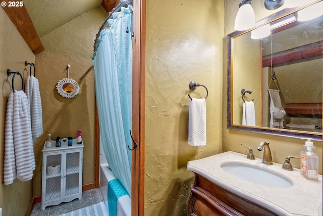 bathroom with vanity and shower / bath combo