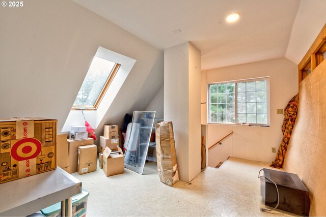 additional living space with lofted ceiling with skylight