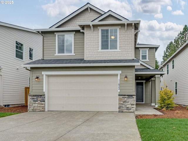 craftsman-style home featuring concrete driveway, a garage, stone siding, and roof with shingles