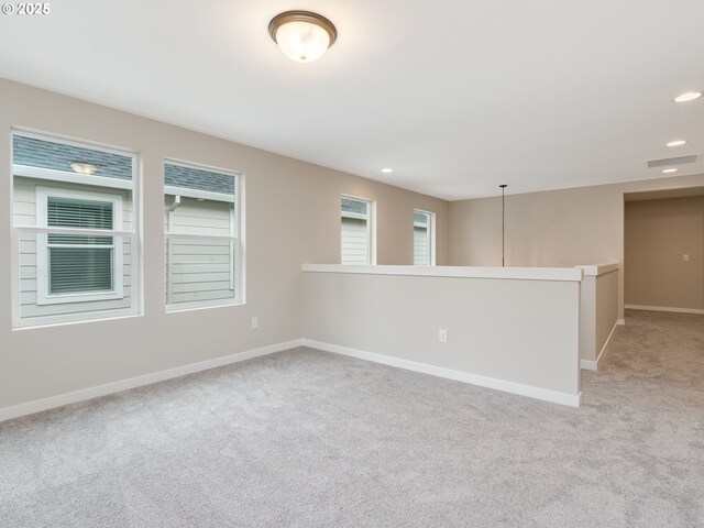 kitchen featuring sink, light hardwood / wood-style floors, white cabinets, a kitchen island with sink, and stainless steel refrigerator with ice dispenser