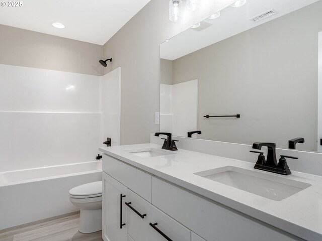 kitchen with wall chimney exhaust hood, electric range, pendant lighting, and tasteful backsplash