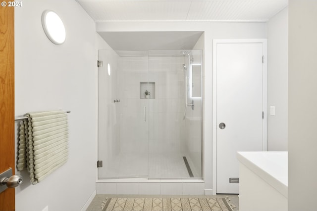 bathroom featuring walk in shower and tile patterned floors