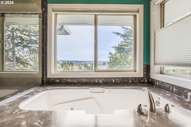 bathroom with tiled tub